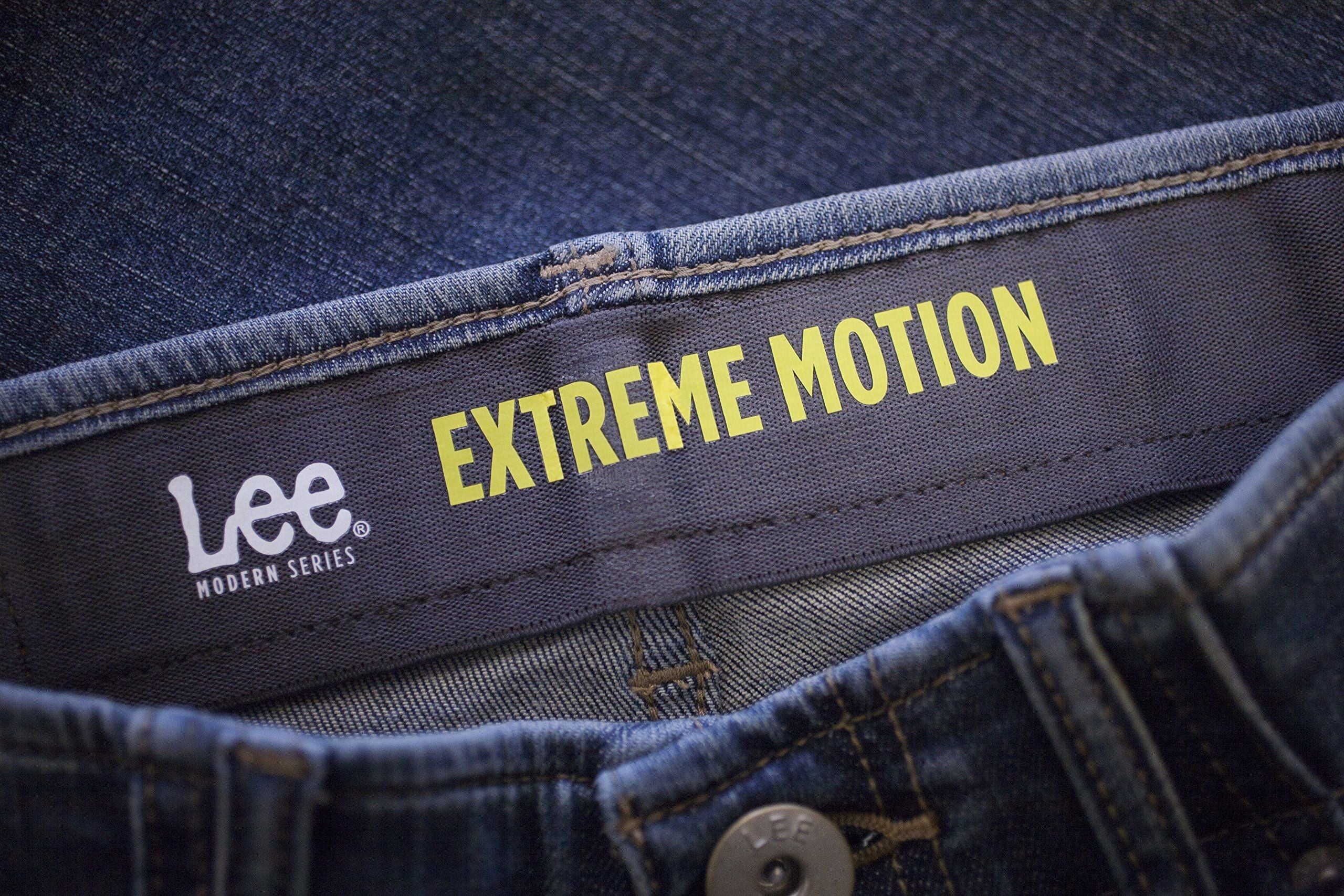 extreme motion straight fit tapered leg jeans